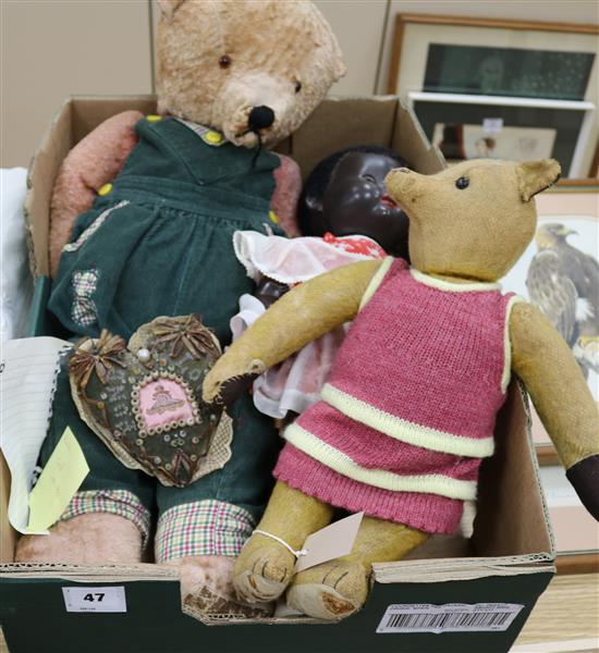 A Pedigree composition black doll, a small early 20C bear, a large bear (faded) and a Royal Artillery sweetheart pincushion